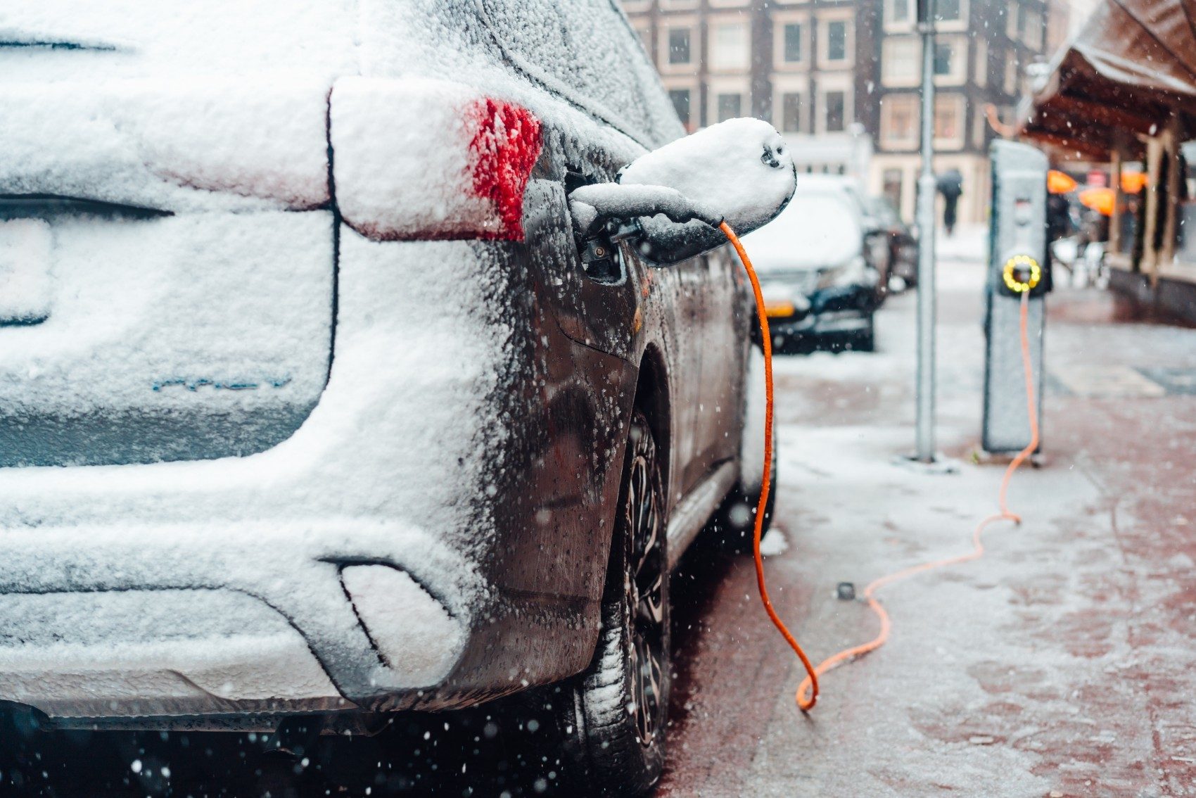 electric-car-plug-charging-in-the-winter-2NYVKW4-1.jpg